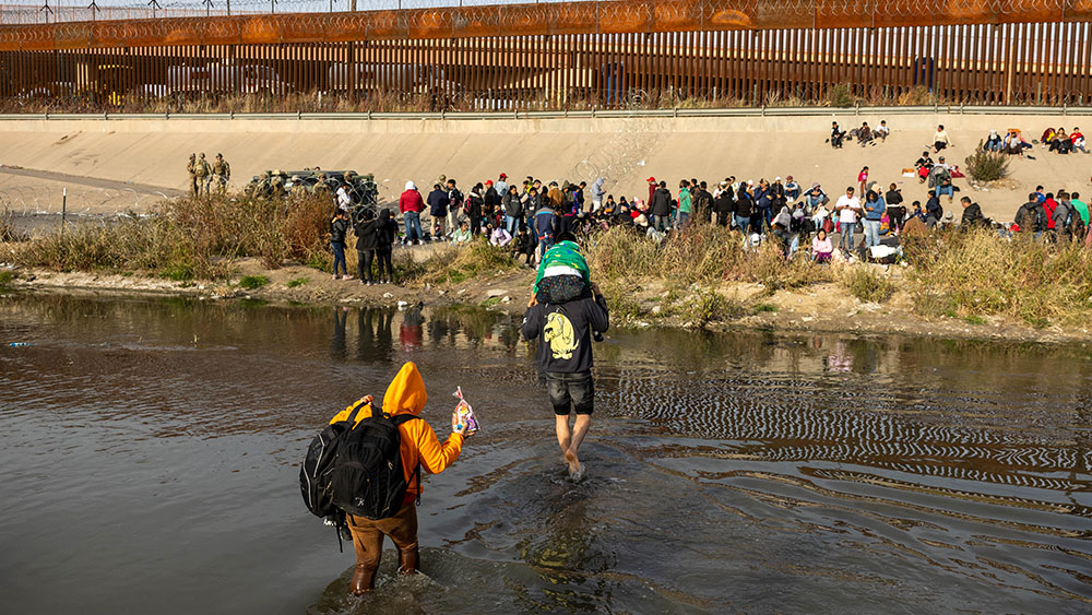 More than 100 migrants storm border and knock down guards in Texas in chaotic scene